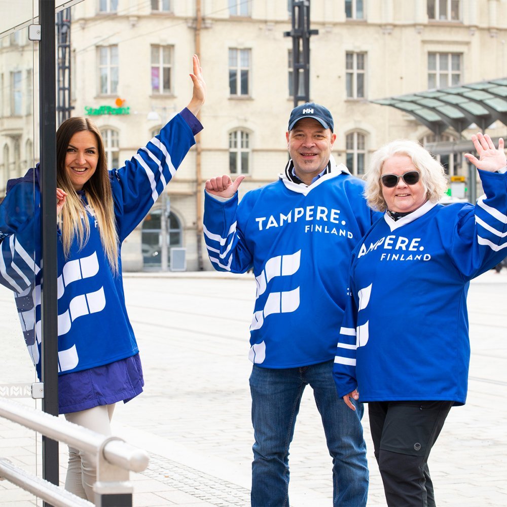 Hockey fans on a bus stop.