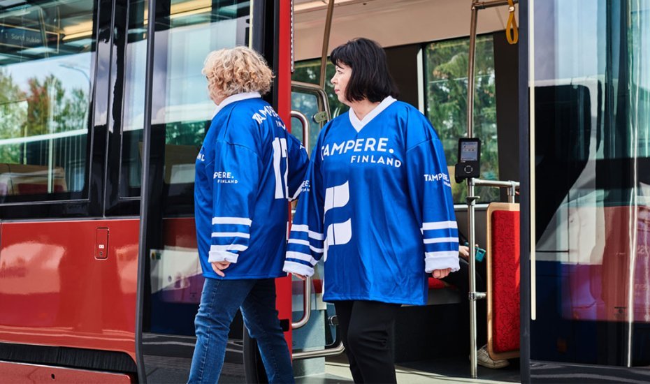 Ice hockey fans and a tram. 