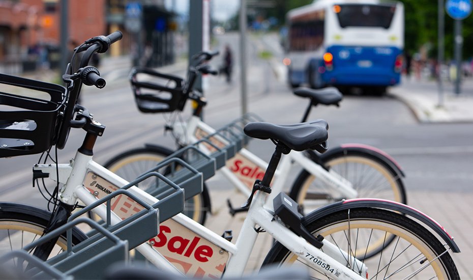 Two city bikes at a city bike station in Hervanta.